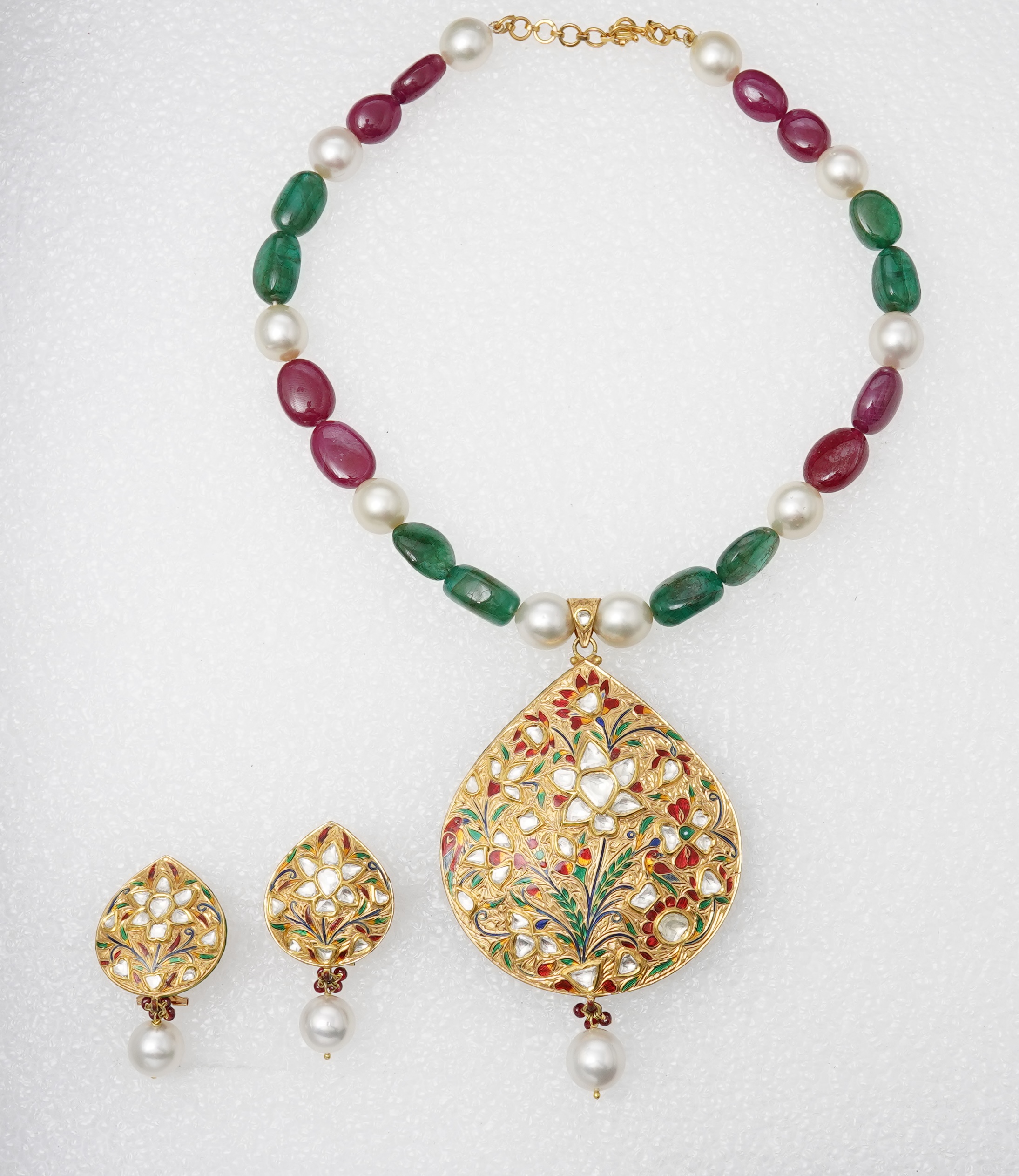 An emerald, ruby, enamel, cultured pearl and diamond demi-parure, India